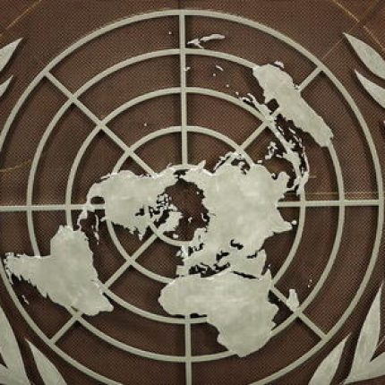 epa09479284 The logo of the United Nations is seen in the General Assembly hall before heads of state begin to address the 76th Session of the U.N. General Assembly in New York City, USA, 21 September 2021.  EPA/EDUARDO MUNOZ / POOL